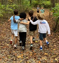 Students arms around each other