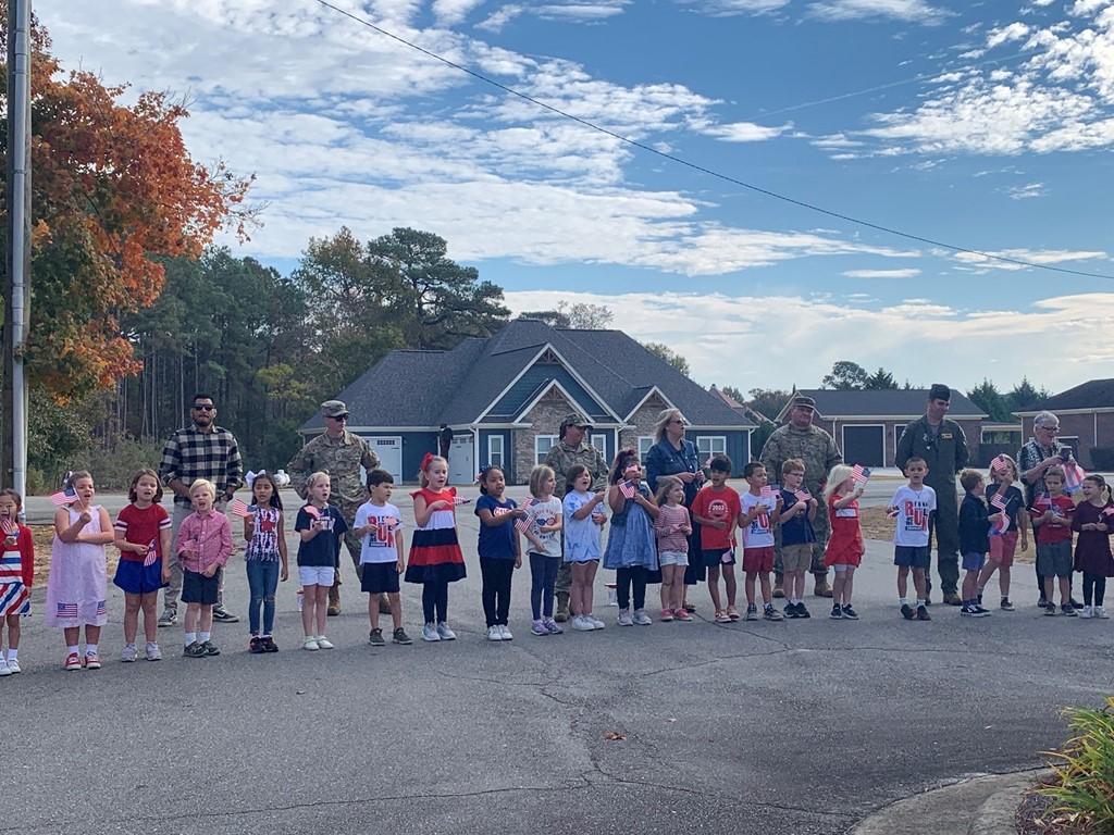 Lower school students singing songs to celebrate our veterans