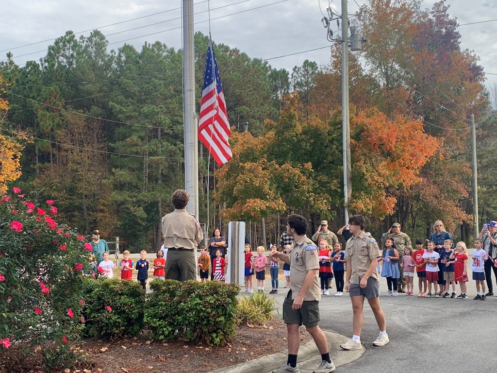 Eagle Scouts raising the flag