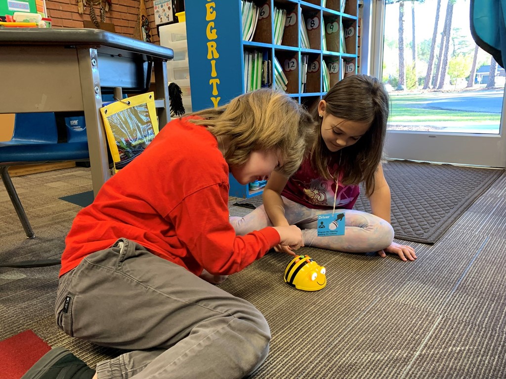 2nd graders playing with Bee Bots
