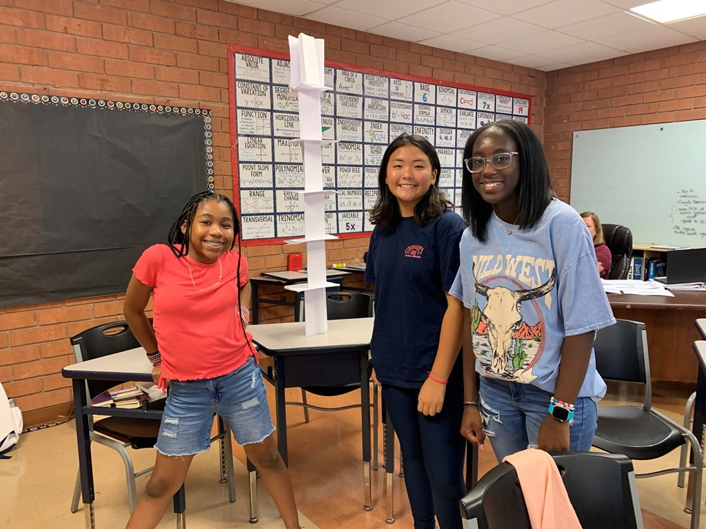 7th graders building paper towers for a challenge