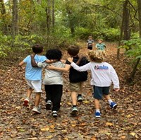 Students with arms around each other